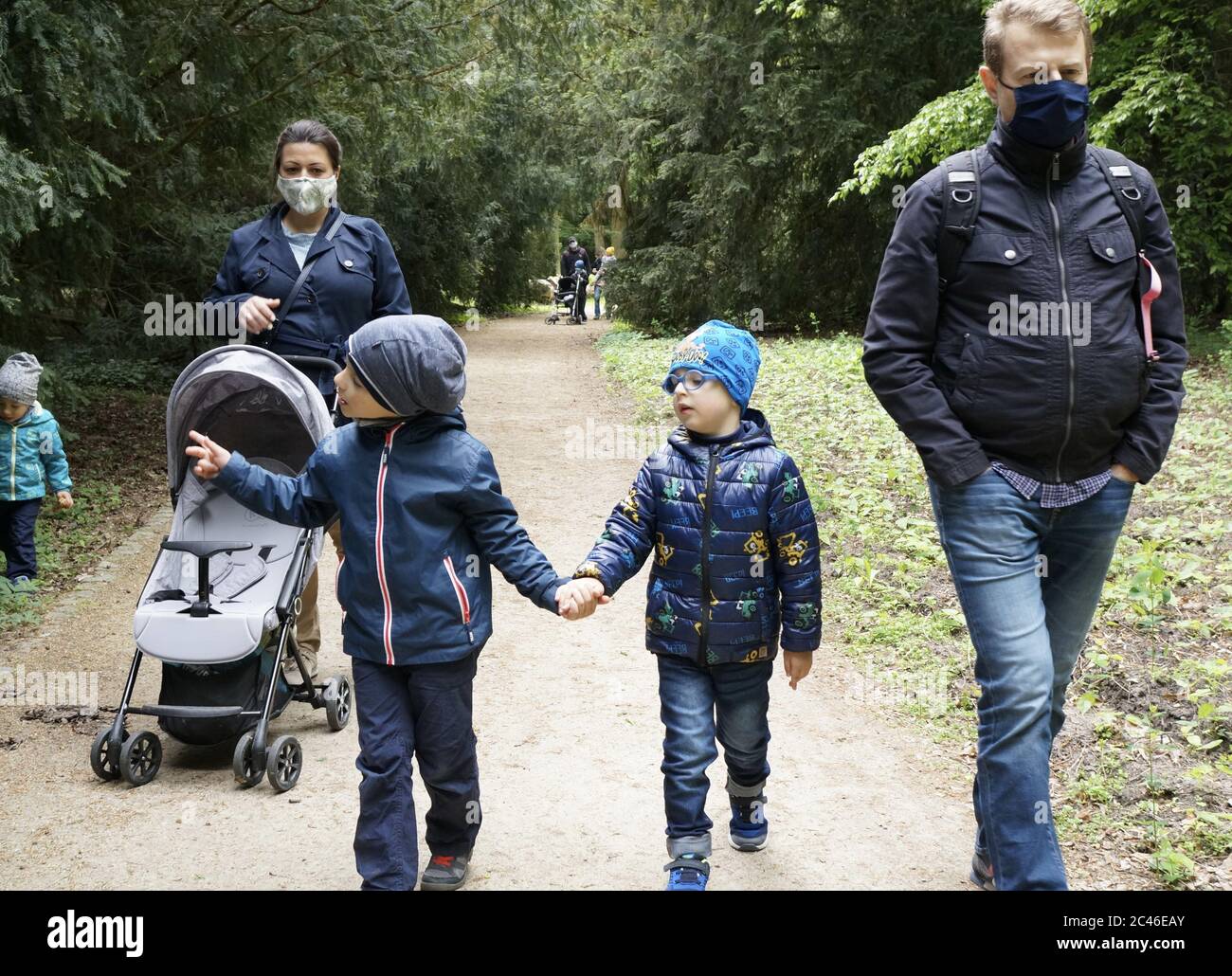 Two children holding hands hi-res stock photography and images - Alamy