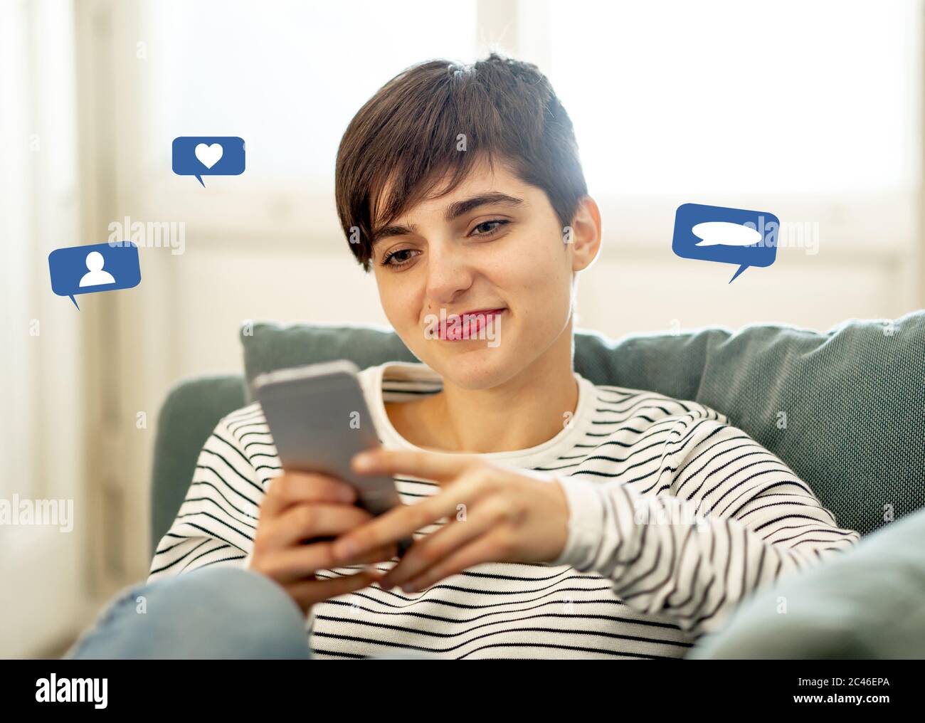 Woman using smart phone with social media or social network notification icons of like, comment, follow me and friend me in Social media marketing and Stock Photo