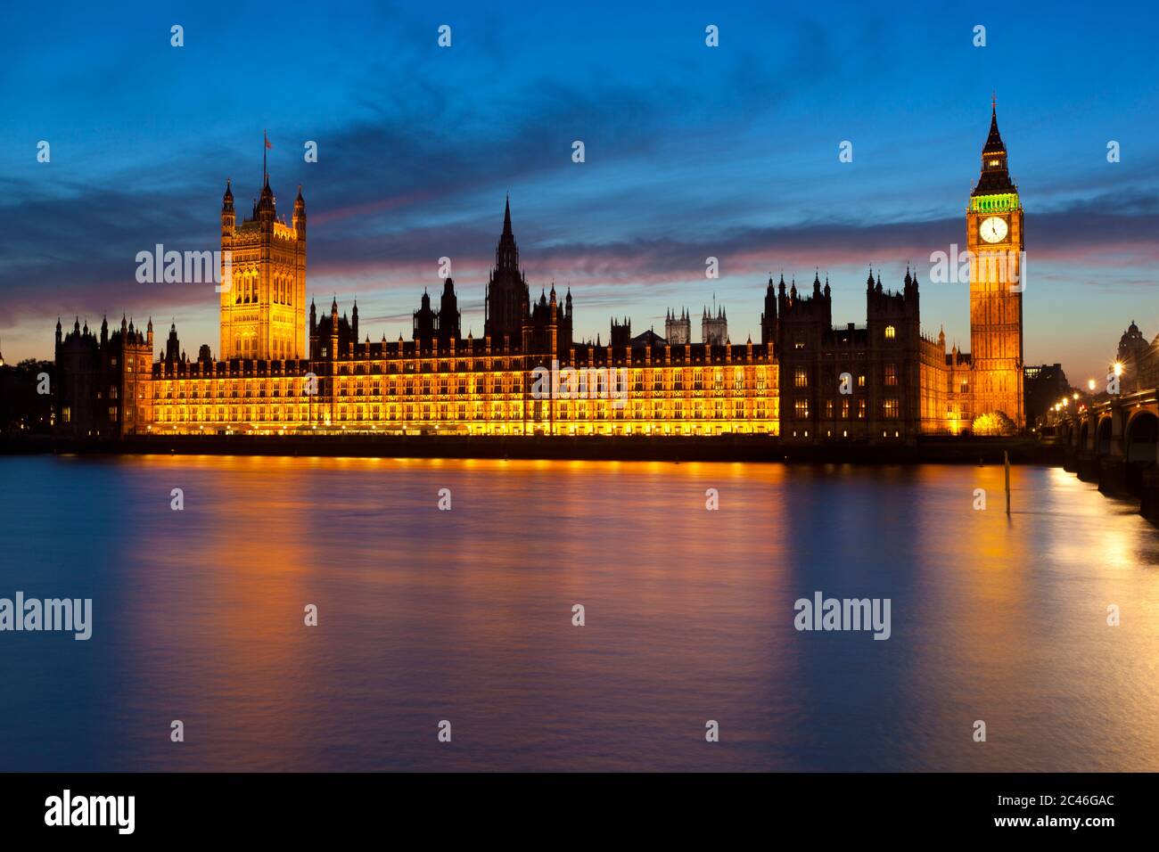View over River Thames to Houses of Parliament and Big Ben at dusk, London, England, United Kingdom, Europe Stock Photo