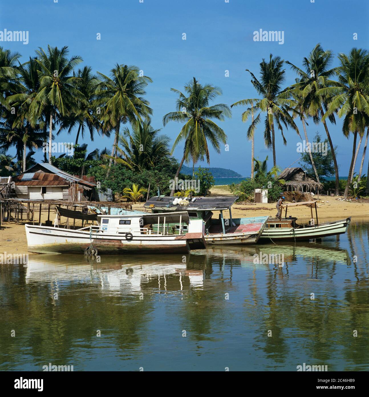 Fishing boats on beach, Marang, Terengganu, Malaysia Stock Photo