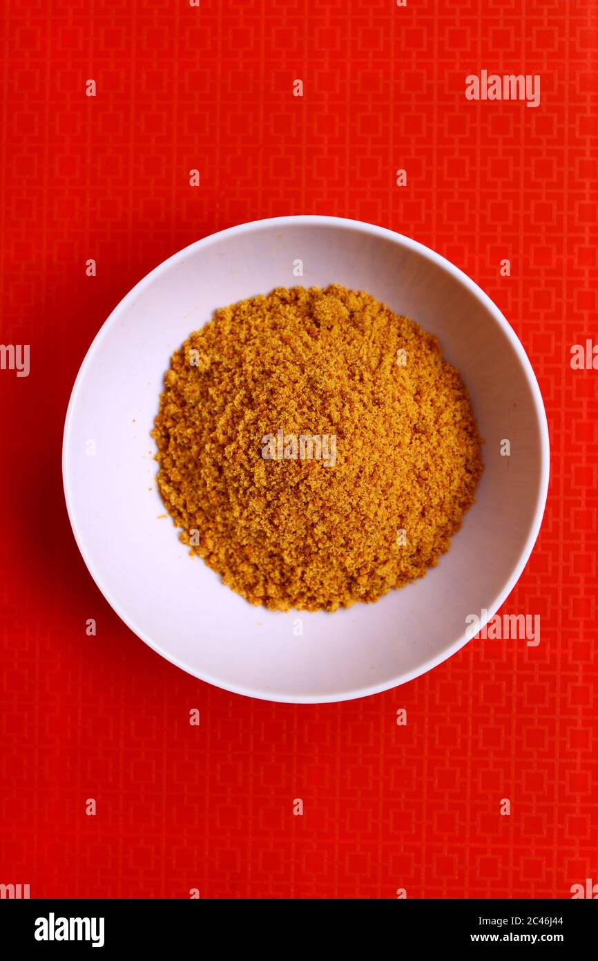 Jaggery powder in a bowl Stock Photo