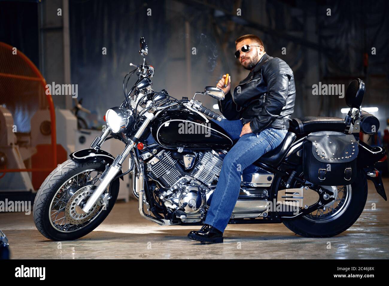 Cool Bearded Man Biker In Sunglasses Sitting On His Motorbike And Smoking Cigar Stock Photo Alamy
