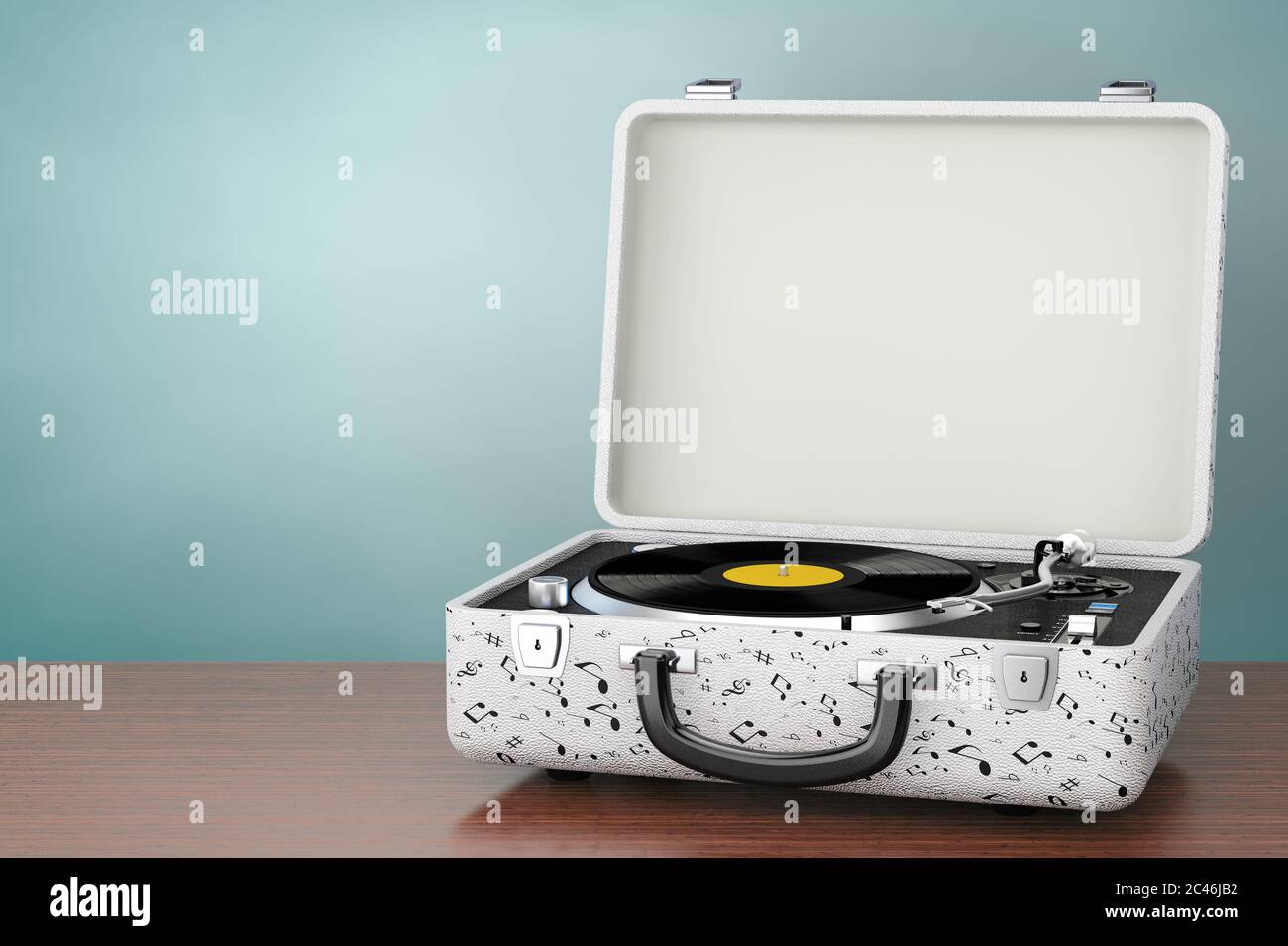 Portable Vintage Style Music Player Turntable In White Case On A Wooden portable-vintage-style-music-player-turntable-in-white-case-on-a-wooden
