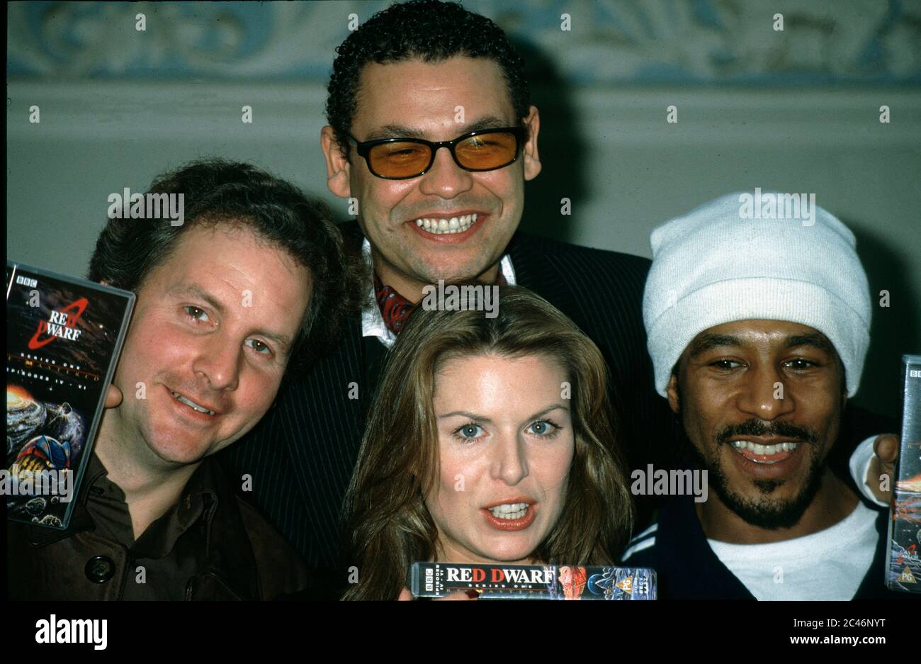 London, UK. LIBRARY. L-R. Chris Barrie, Craig Charles, Chloe Annett and  Danny John-Jules. Red Dwarf cast at a photocall to celebrate 10 years of  the TV series. 3rd March 1998. RECAP, 05.06.2020