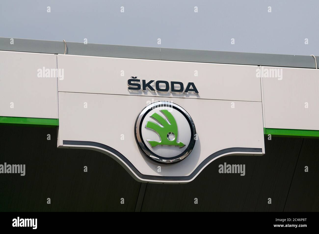 Lugano, Ticino, Switzerlad - 3rd June 2020 : View of the Czech Škoda car dealership logo hanging in front of the garage building in Lugano. is a Czech Stock Photo