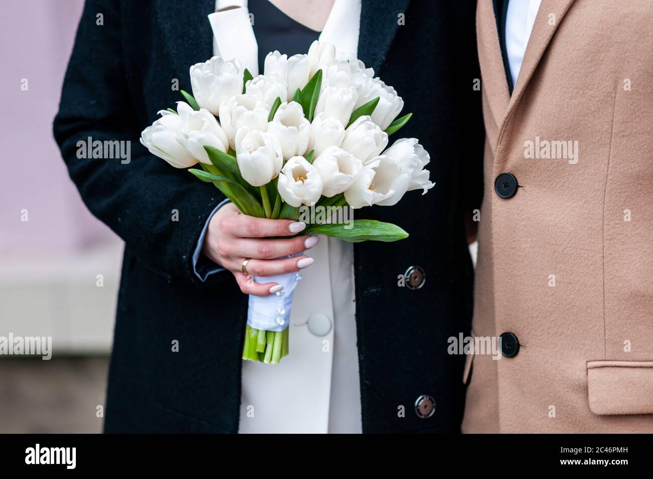 White wedding bouquet in the hands of bride Stock Photo