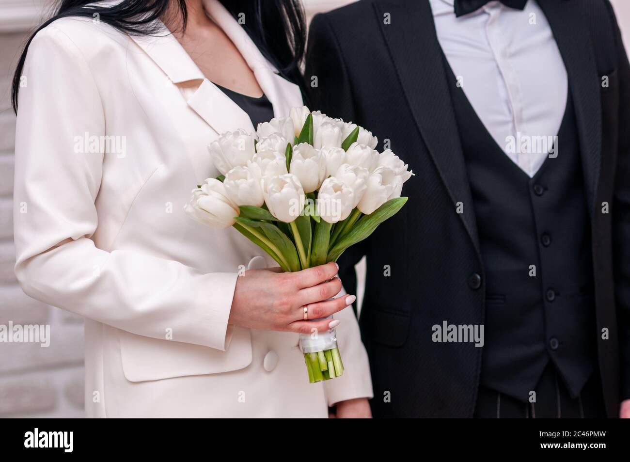 White wedding bouquet in the hands of bride Stock Photo