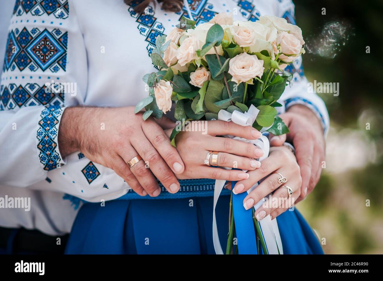 Colorfull wedding bouquet in the hands of bride Stock Photo