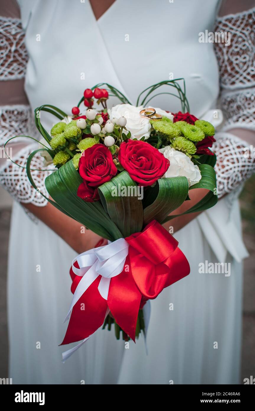 Colorfull flower bouquet of flowers in the hand of the bride Stock Photo
