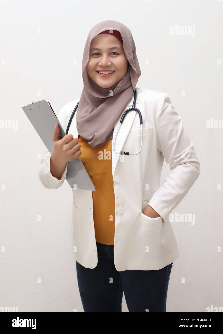Asian muslim female doctor wearing hijab with stethoscope in white coat