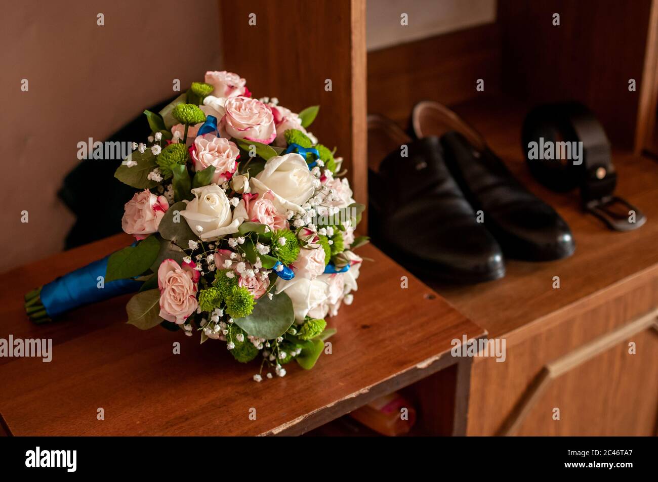 Bouquet of roses lying on the old table Stock Photo