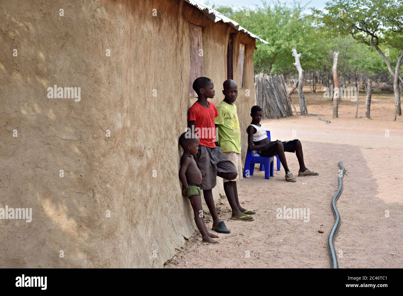 KAMANJAB, NAMIBIA - FEB 1, 2016: Little unidentified Himba children shown in himba tribe village Stock Photo