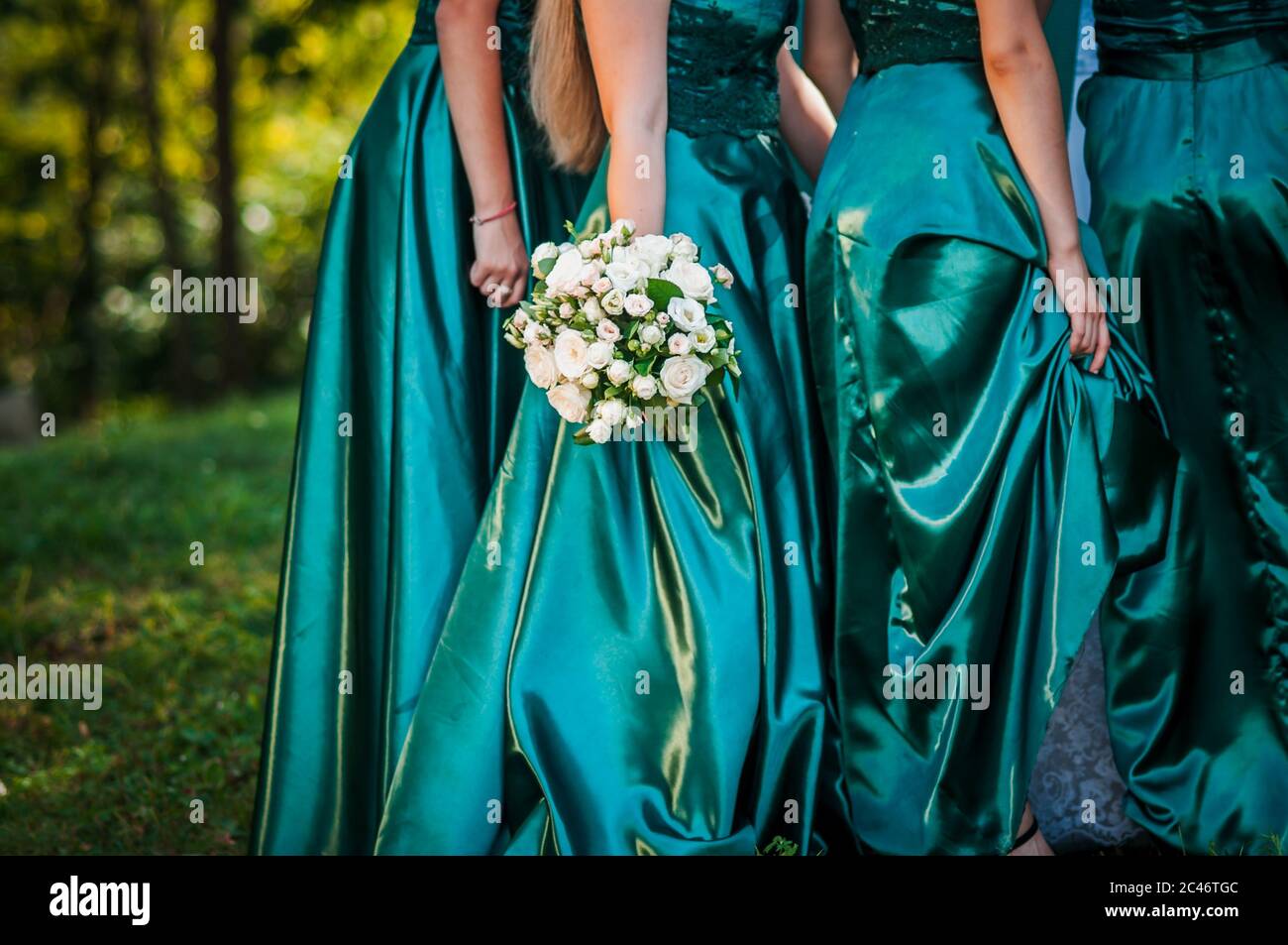 Bouquet of flowers in the hand of bridesmaid Stock Photo