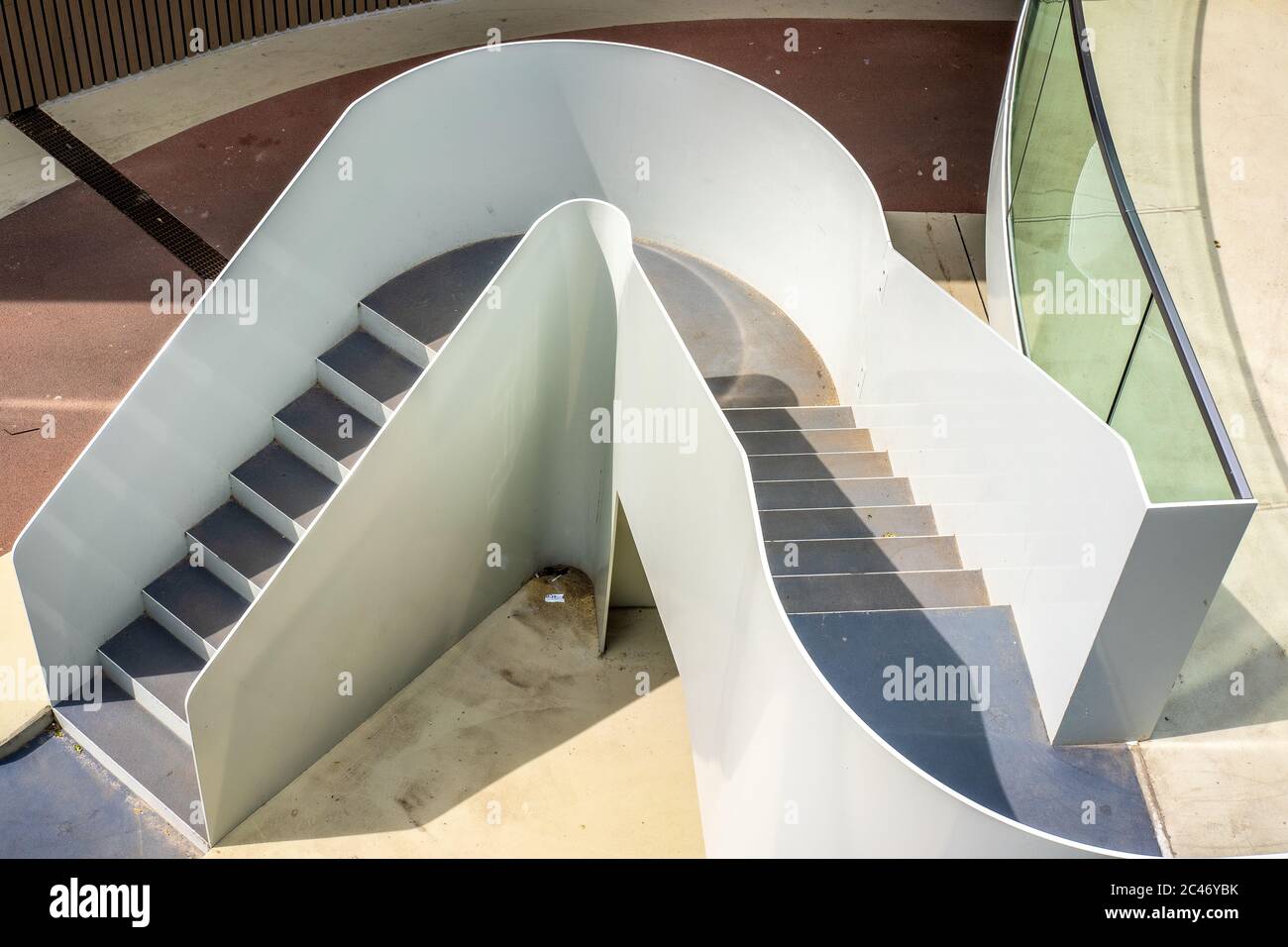 High angle shot of a white elegant staircase on the road with arrows and brown lines Stock Photo