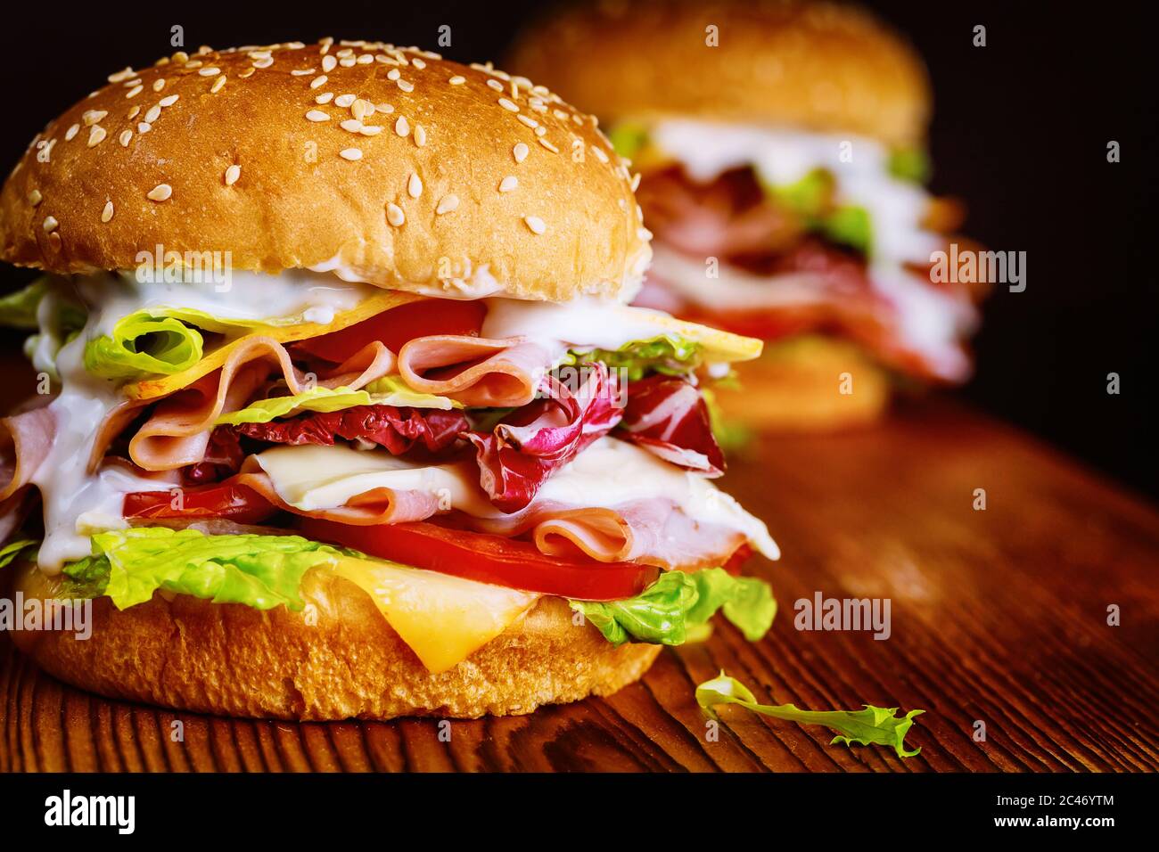 Colorful sandwich with burger bun, vegetable and ham Stock Photo Alamy
