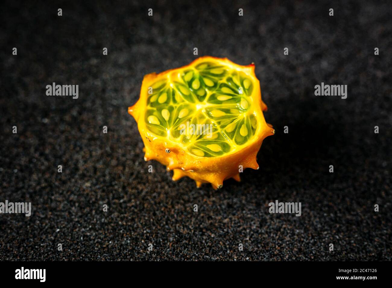 Kiwano fruit cut in half on dark grey background Stock Photo Alamy
