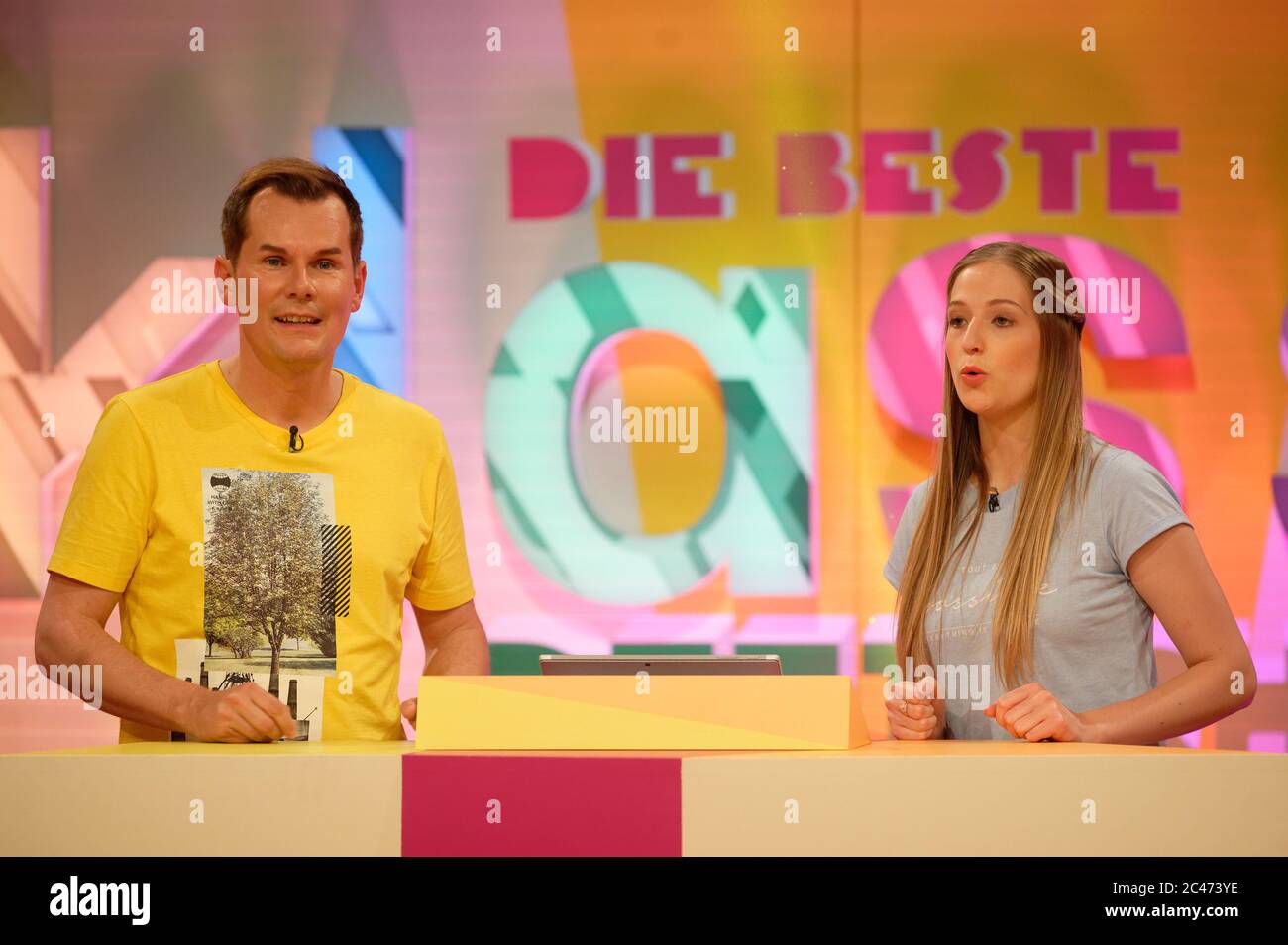Cologne, Germany. 24th June, 2020. The presenters, Malte Arkona and Kim Unger (l-r) are about to record the KIKA TV show "The best class of Germany" in the studio. The Superfinal of the Rat Show will be broadcast on September 5, 2020. Credit: Henning Kaiser/dpa/Alamy Live News Stock Photo