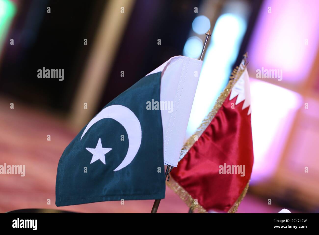 Qatar & pakistan flage on table Stock Photo