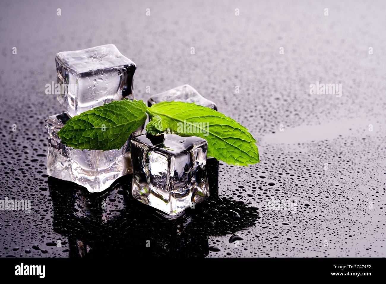 Ice cubes and mint on wet background Stock Photo - Alamy