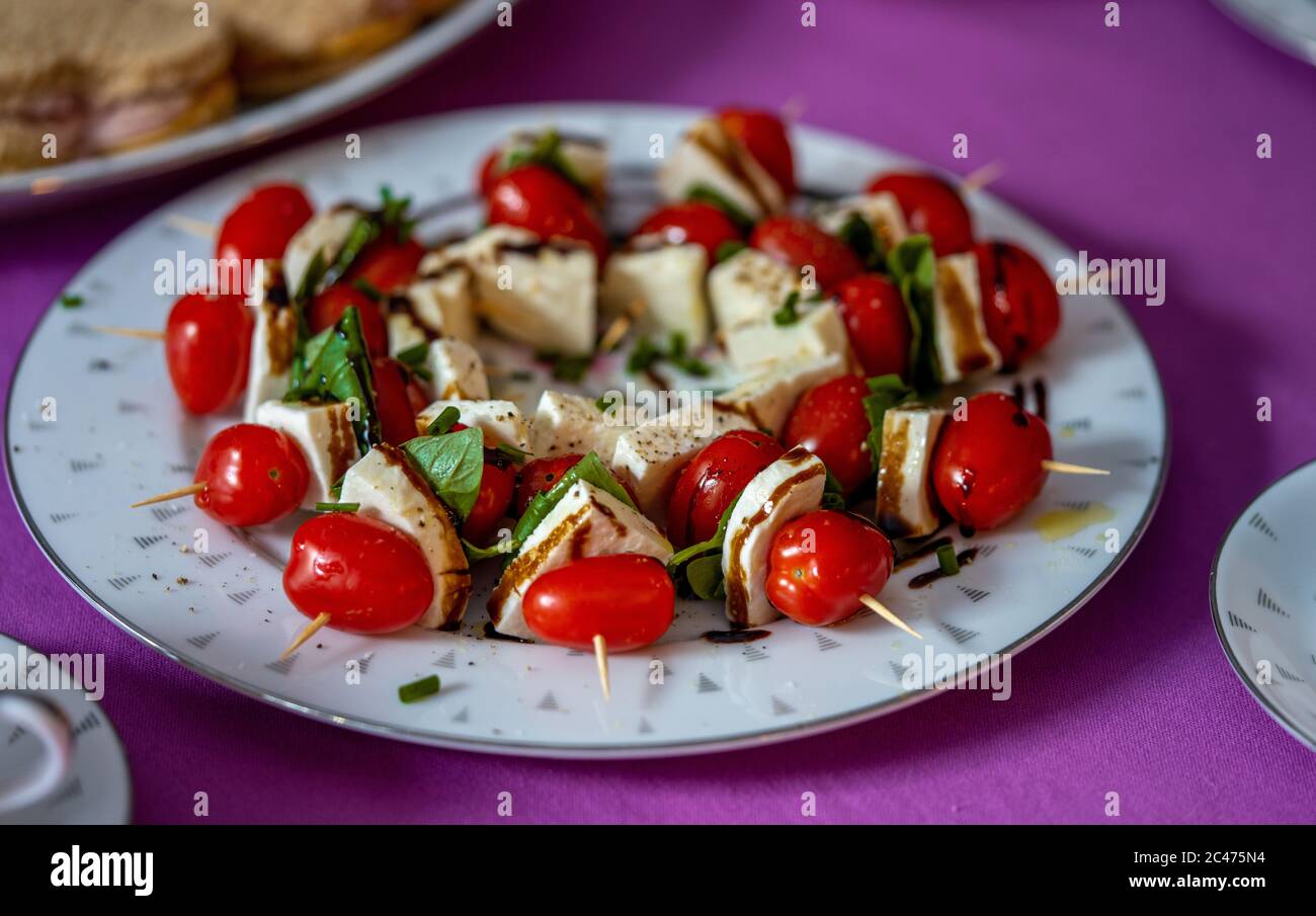 Foods from a party we had. Plated sandwiches, Caprese Salad, Rustic Bread and Truffles. All home made and fresh ingredients. Stock Photo