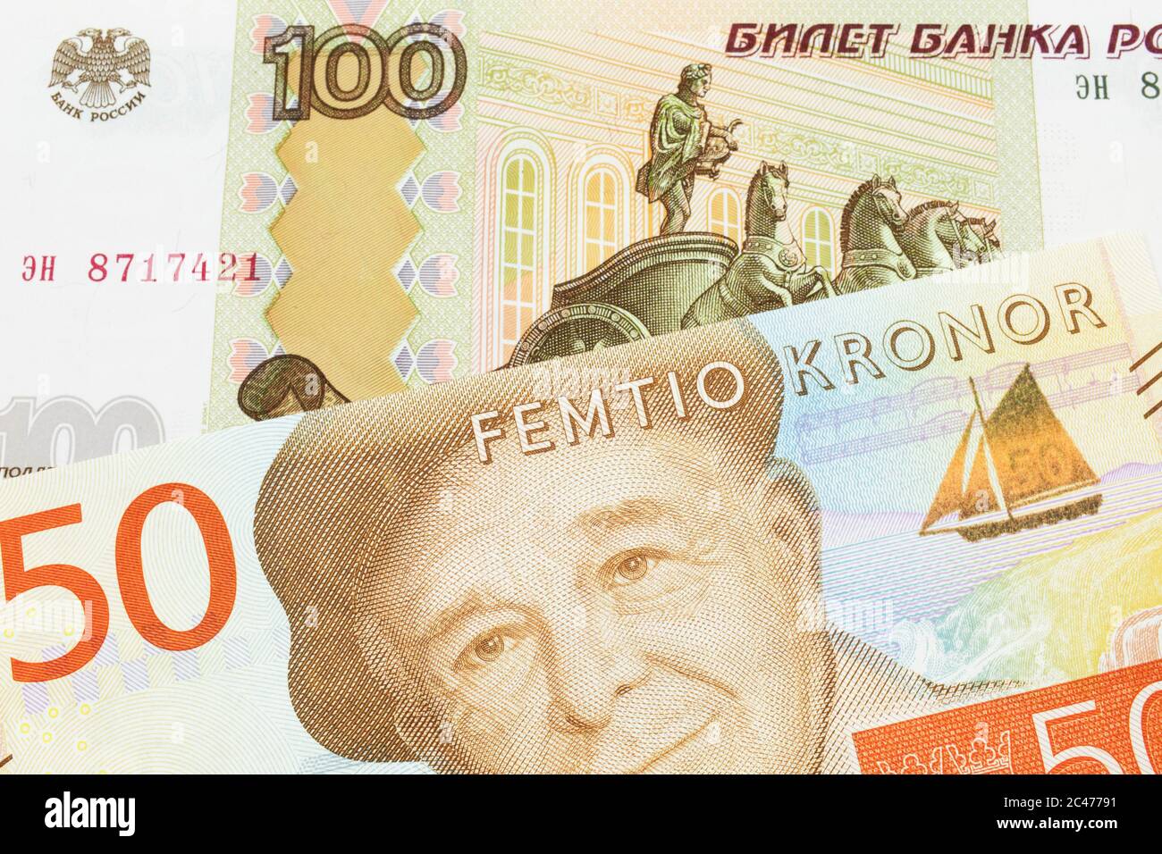 A Macro Image Of A Russian One Hundred Ruble Note Paired Up With A Gray 