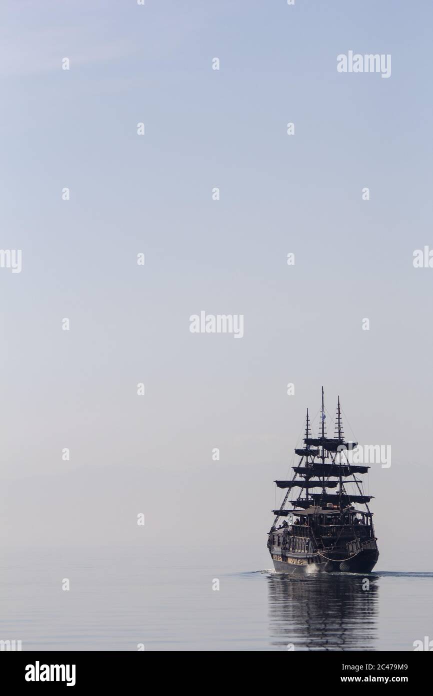 Vertical shot of a tall ship sailing on the calm water Stock Photo - Alamy