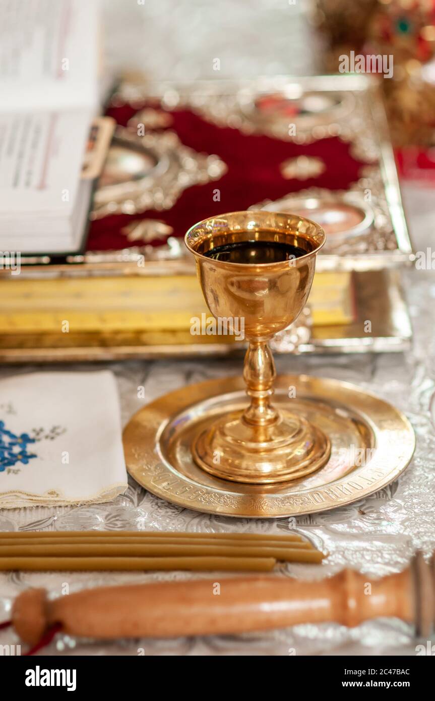 church gold chalice with wine on the golden plate Stock Photo Alamy