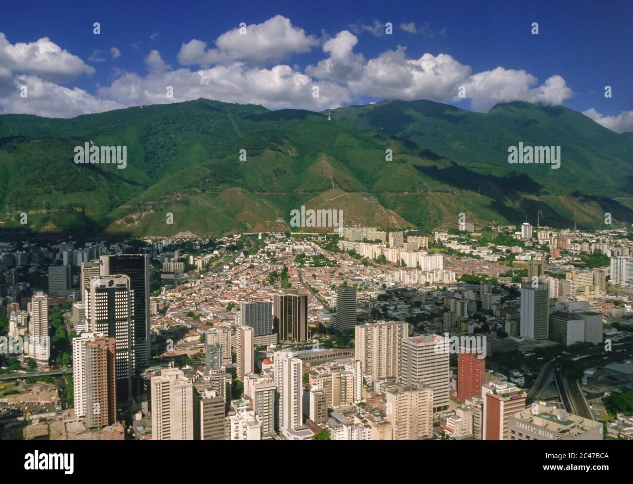 CARACAS, VENEZUELA - Aerial view of downtown Caracas and El Avila park mountain ridge. Stock Photo