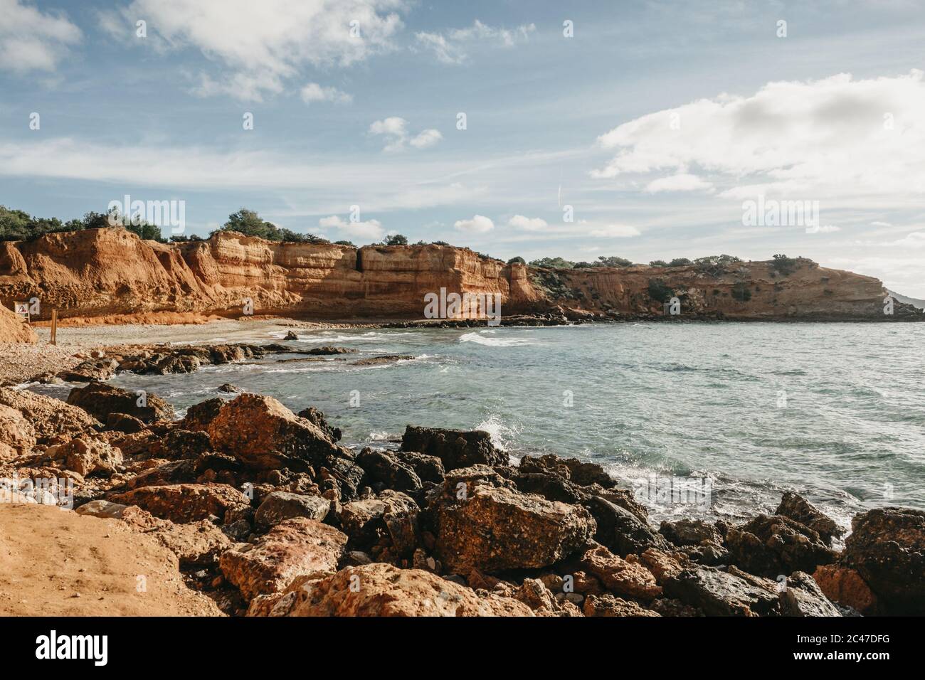 Beautiful scenery of rocky cliffs by the sea under a cloudy sky Stock ...