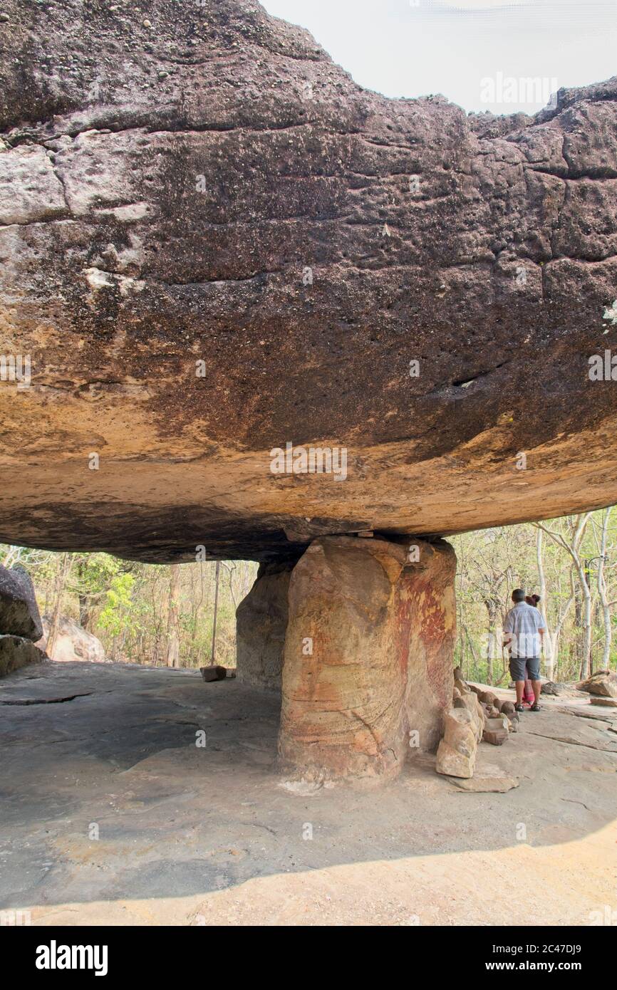 Phu Phra Bat Park, Unusual rock formations formed by erosion Adopted Buddhist shrine Large boulder supported by stone supports Figure in image Stock Photo