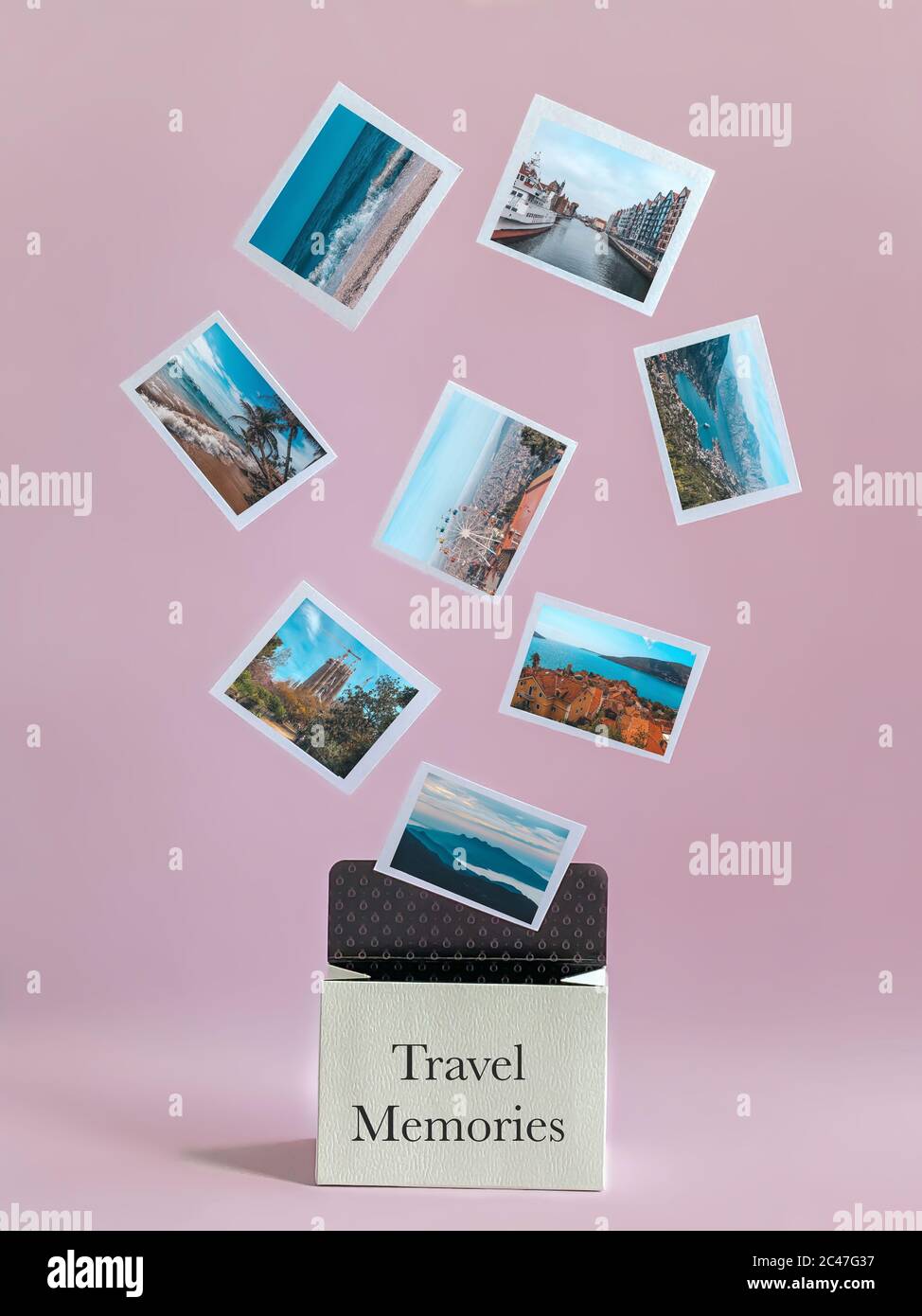 Travel template, levitating travel photos flew out of a small suitcase with memories. Stock Photo