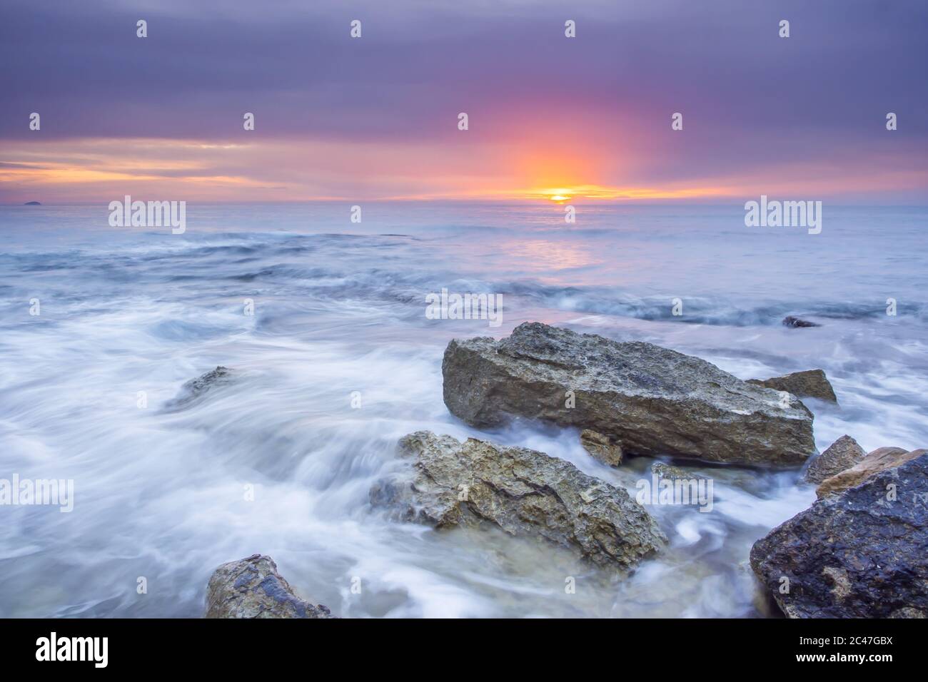Beautiful scenery of waterfall in the sea with rock formations at ...
