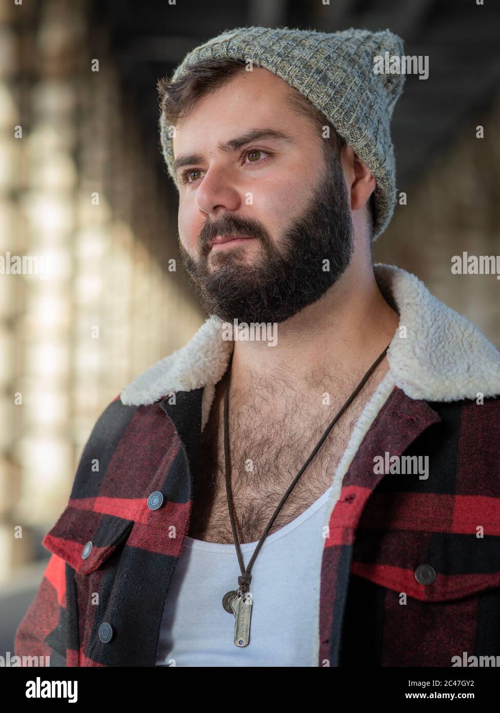 Young french bearded man, taken outside with natural light in Paris, France Stock Photo