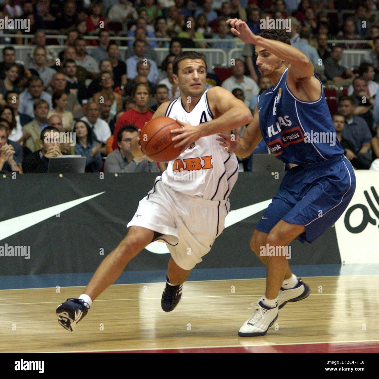 Westfalenhalle Dortmund Germany 21.8.2002, Basketball, Germany vs Greece —  MITHAT DEMIREL (GER) , CHRISTOS CHARISSIS (GRE Stock Photo - Alamy