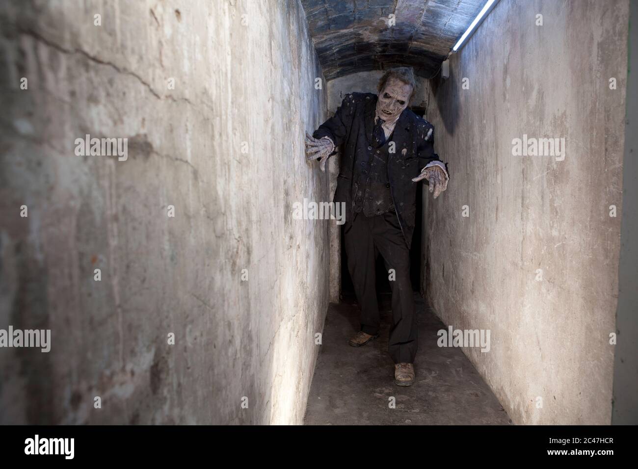 Zombie in a tunnel Stock Photo