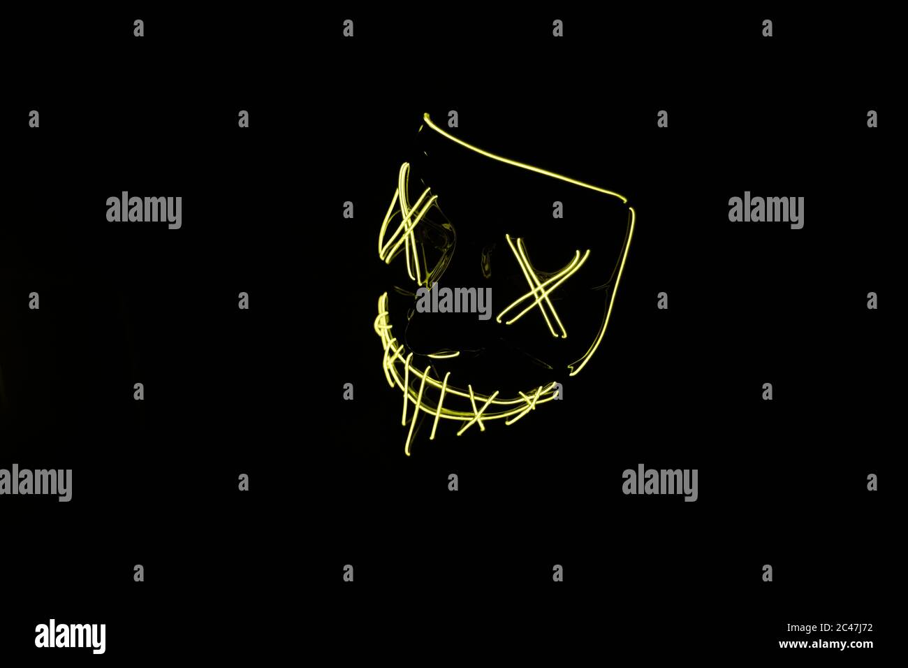 The Yellow Led Mask For Partying Isolated On A Dark Background Stock Photo Alamy