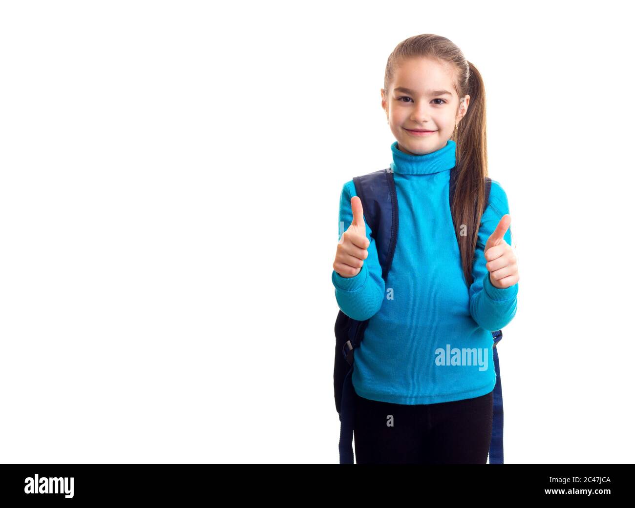 Schoolgirl show thumbs up at white isolated background Stock Photo - Alamy