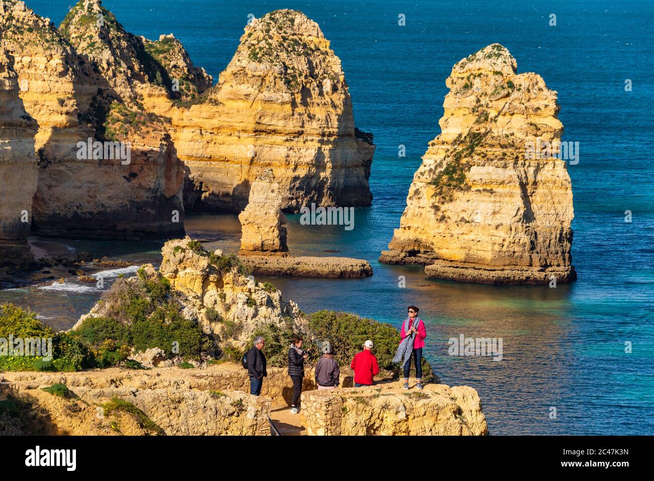 Lagos, Portugal - 5 March 2020: Tourists visiting Ponta da Piedade Stock Photo