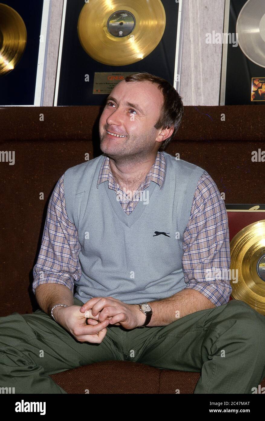 Genesis receiving gold discs backstage at the NEC Birmingham 26th