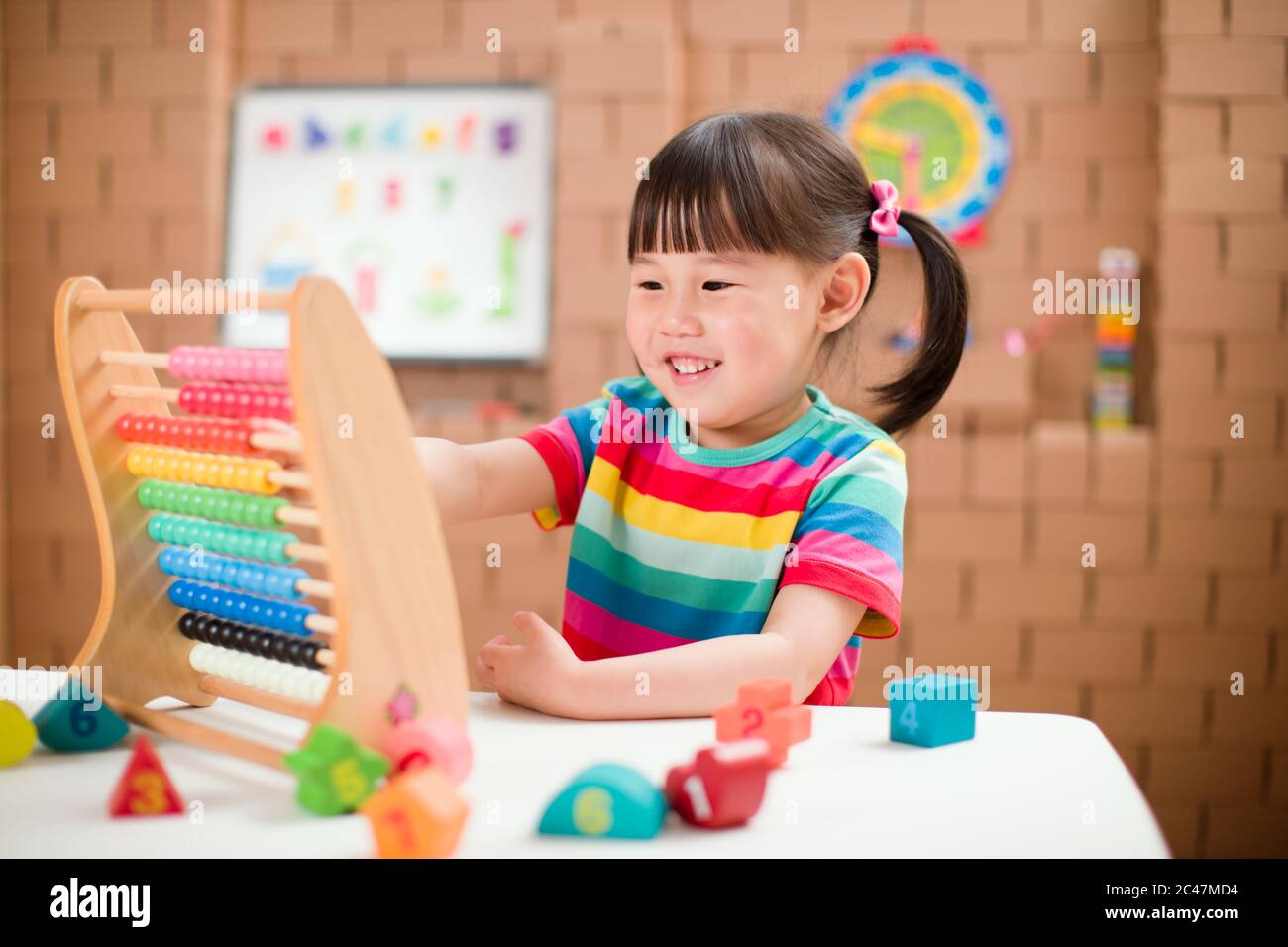 oddler girl learn counting by using abacus for homeschooling Stock ...
