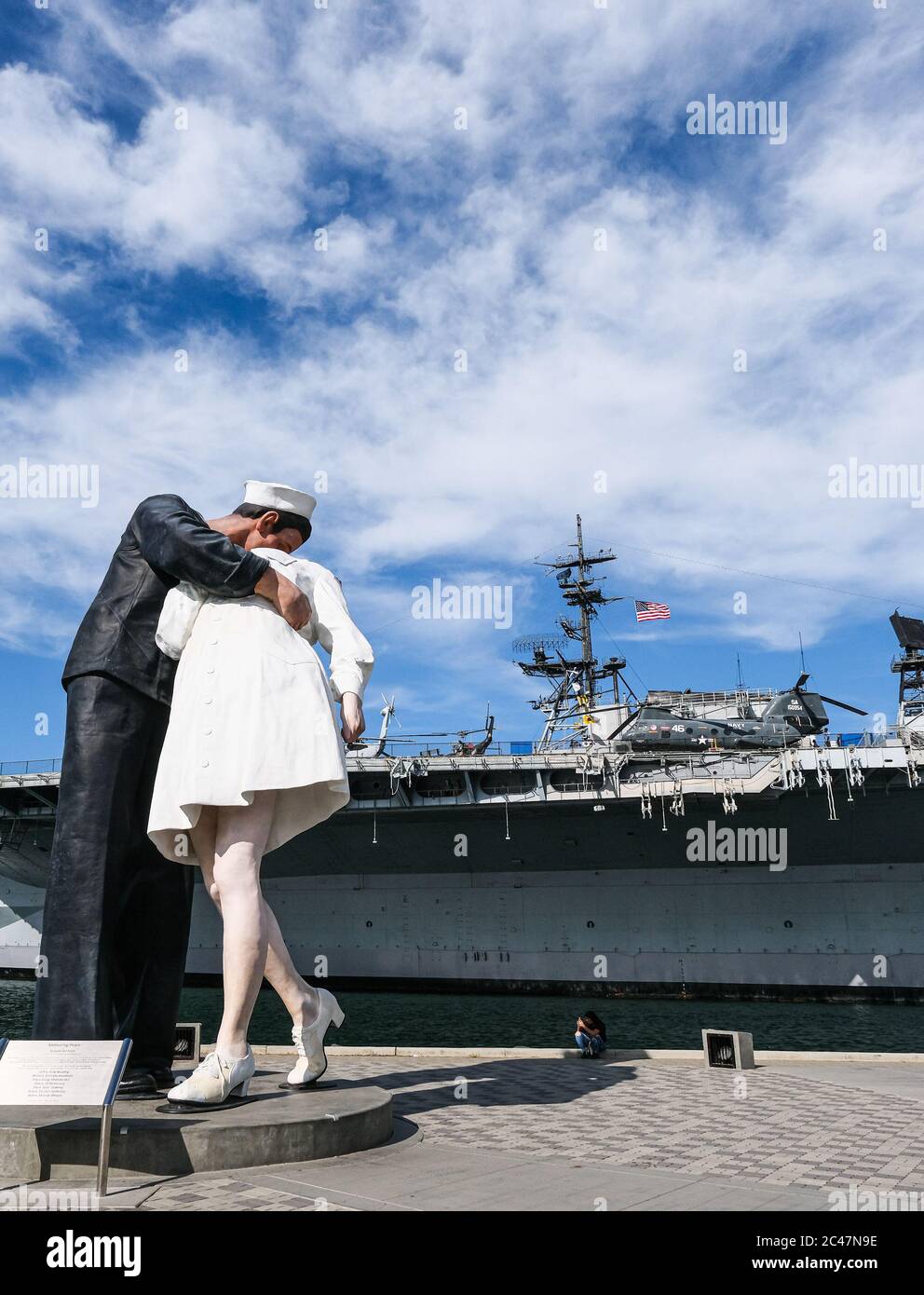 Unconditional Surrender Statue with Midway in Background Stock Photo