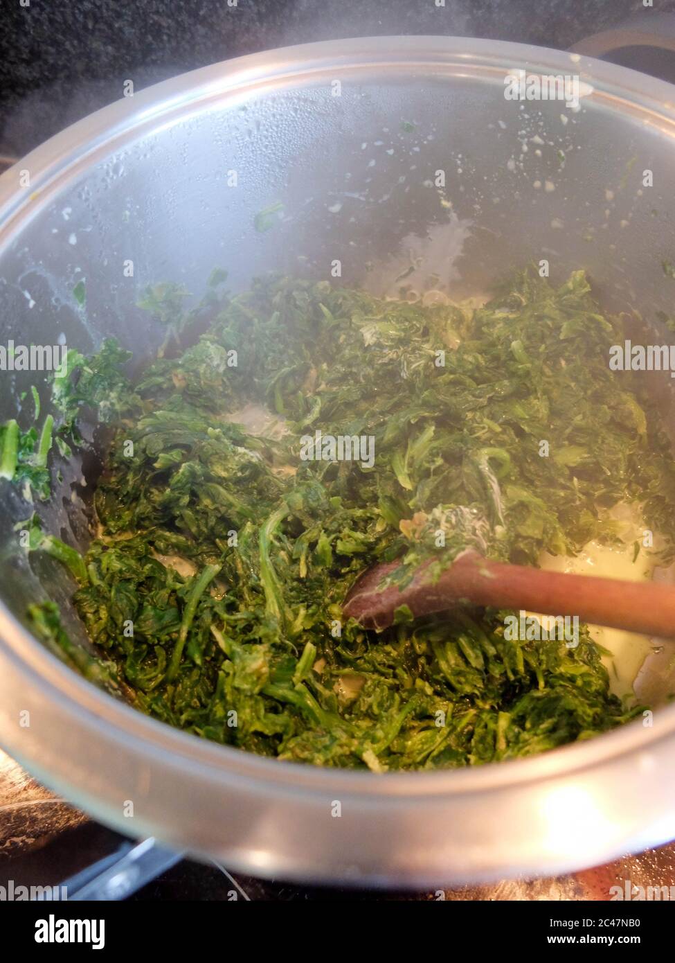 Spinach cooked in a span Stock Photo