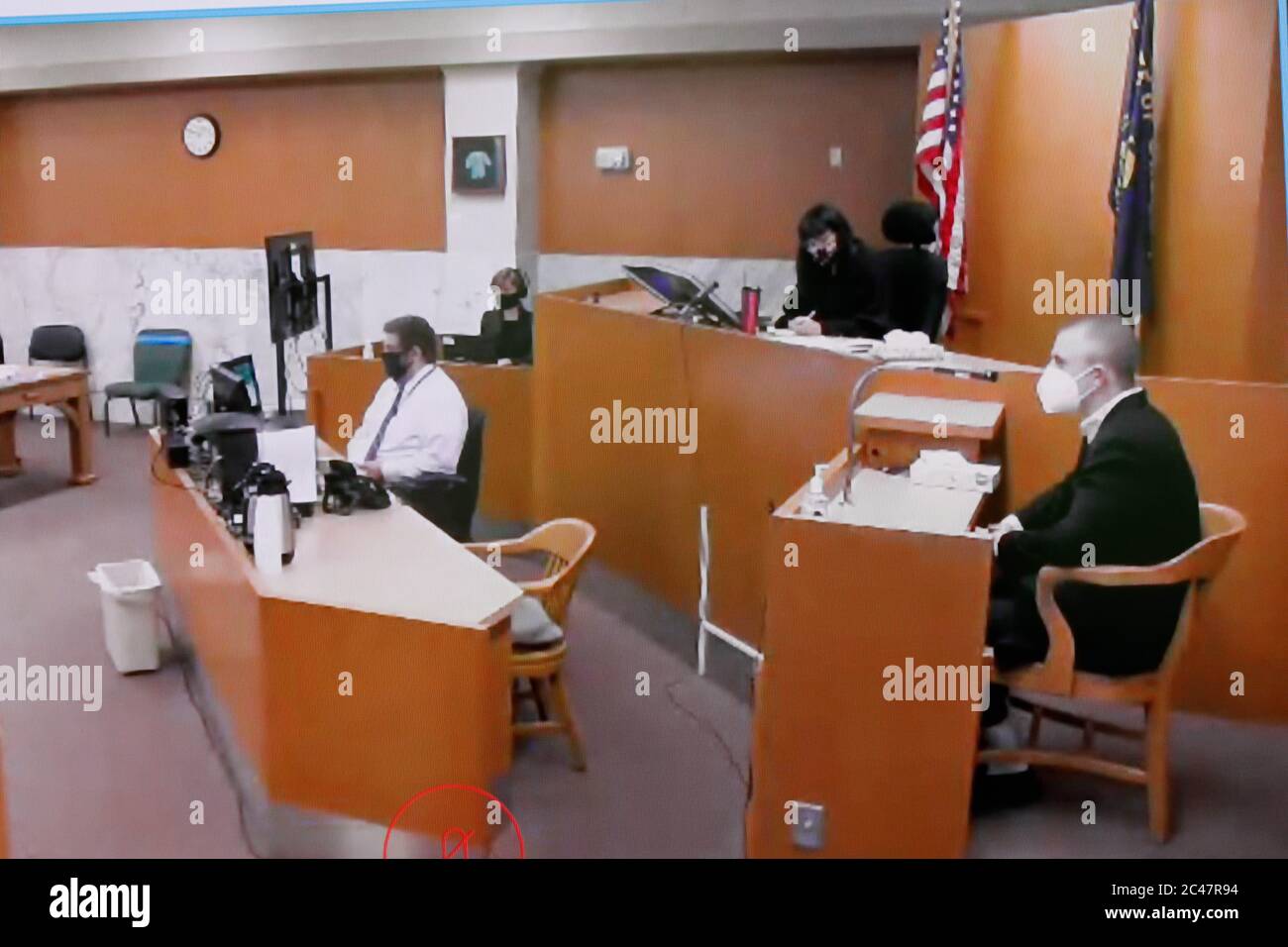 On this monitor image, stabbing survivor Micah Fletcher (R) gives a ...