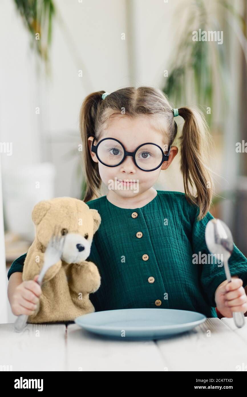 Little Cute Girl Waiting Breakfast With Bear Toy Little Cute Girl At White Dining Table In Kitchen Stock Photo Alamy
