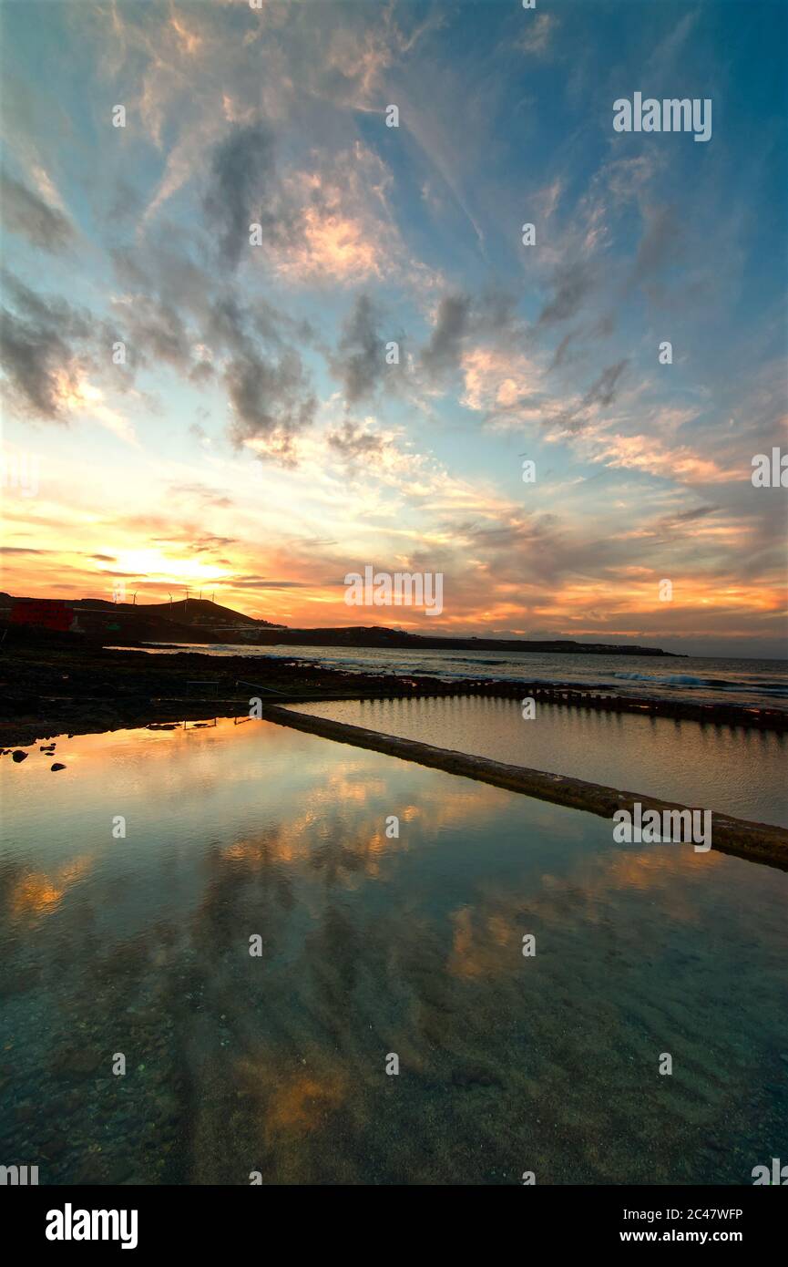 Beautiful scenery of the peaceful sea with the reflection of sunset ...
