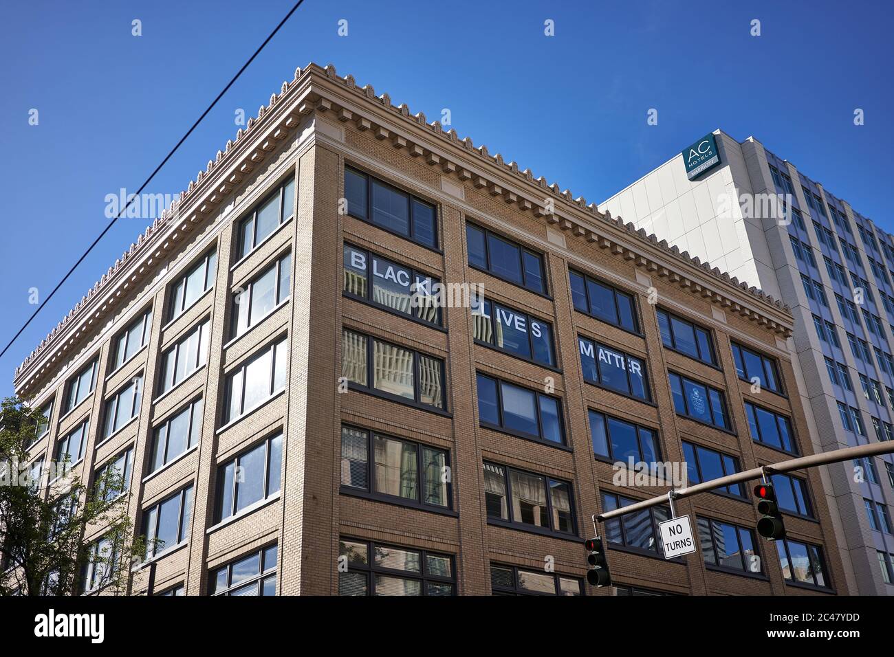 Black Lives Matter sign is seen on the windows of the Director Building in downtown Portland, Ore., on Tuesday, 6/23/2020, amid the ongoing BLM protest. Stock Photo