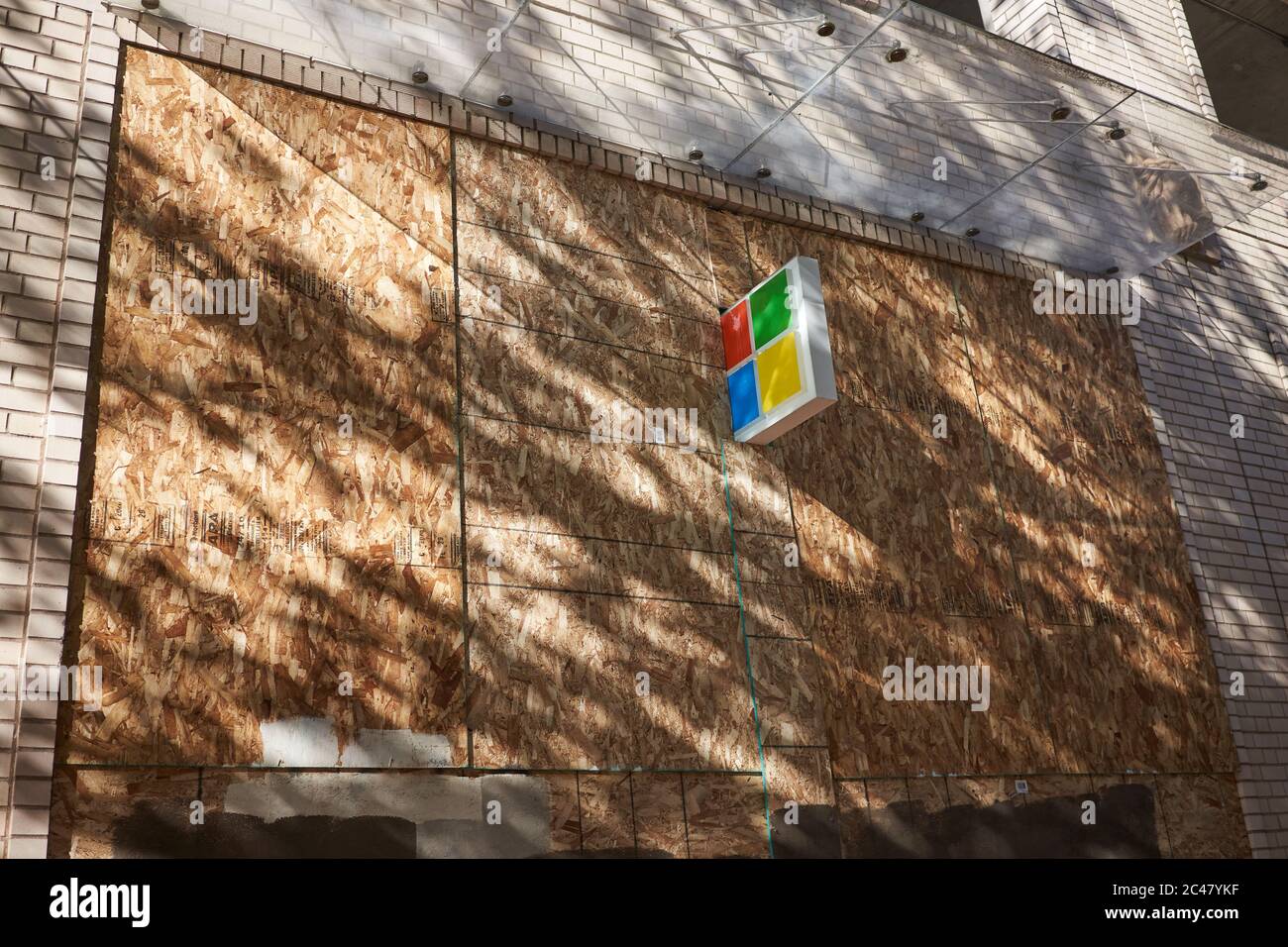 Closed and Boarded up Microsoft store in downtown Portland, Oregon, amid the ongoing BLM protest and coronavirus pandemic, seen on Tuesday, 6/23/2020. Stock Photo