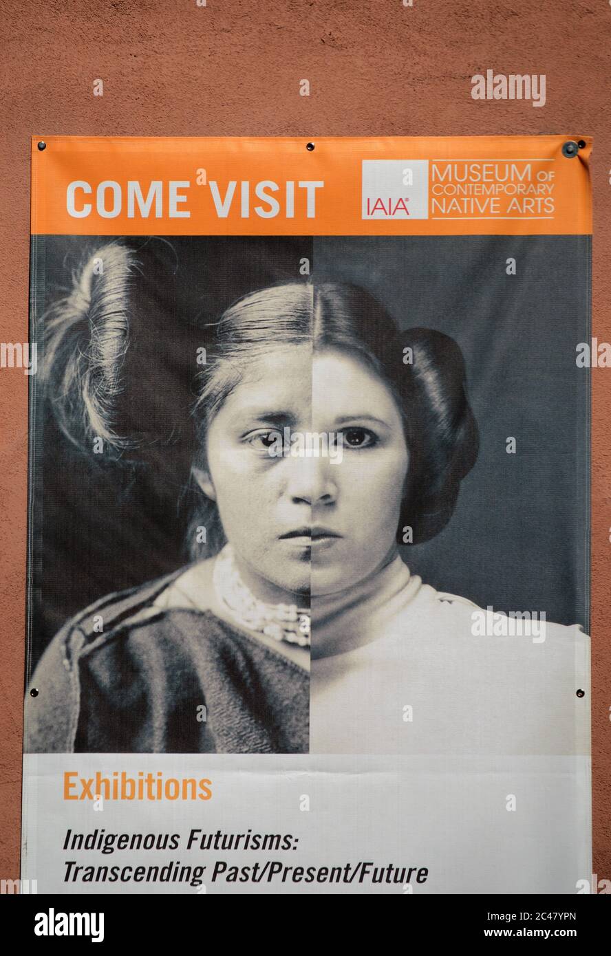 A mural hanging on the front of a Native-American art museum features a creative combination of photos of an historic Hopi girl and Princess Leia. Stock Photo