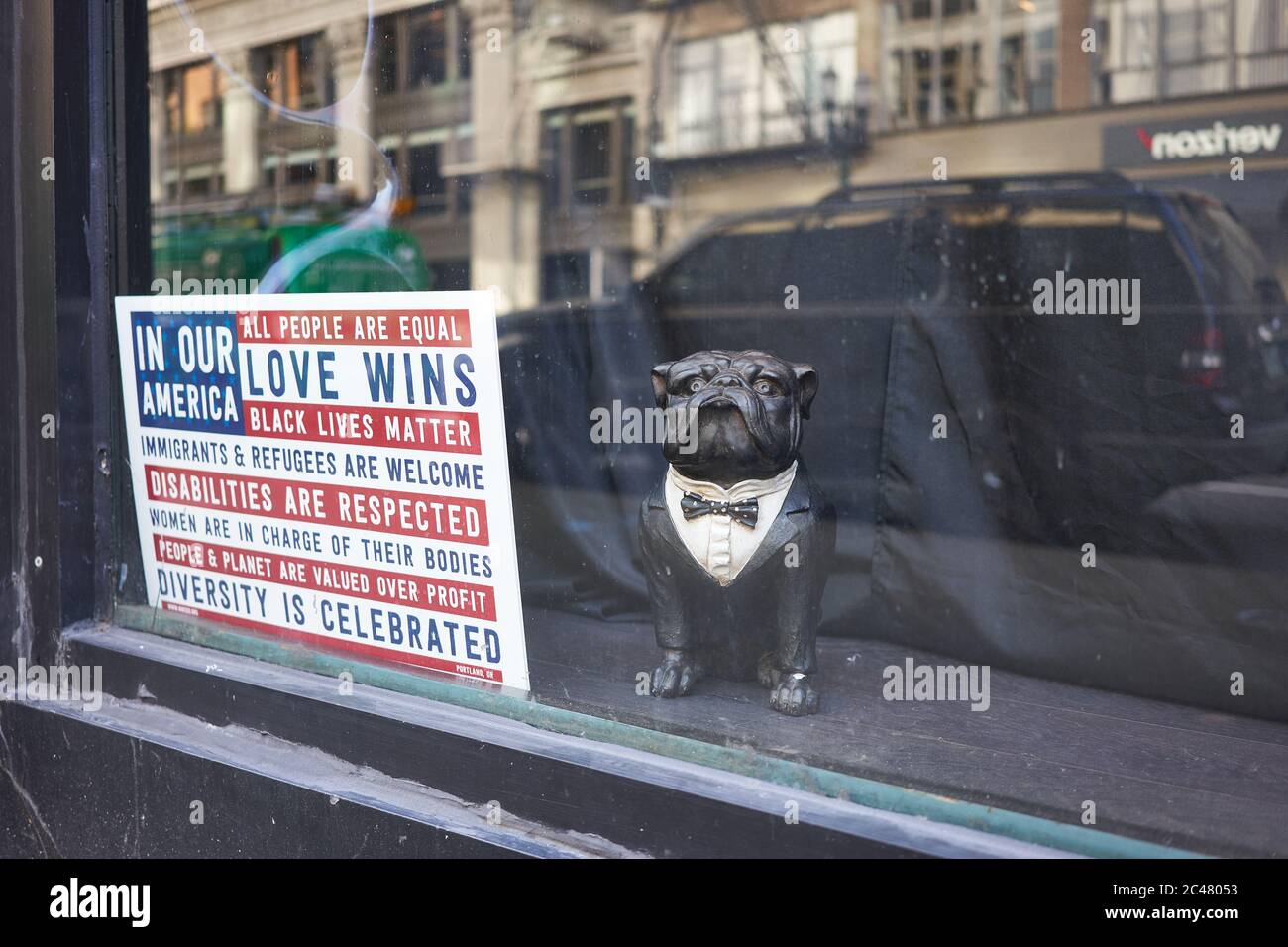 Pro-democracy and Black Lives Matter movement signage is seen in a closed retail store in downtown Portland, Oregon, on Tuesday, Jun 23, 2020. Stock Photo