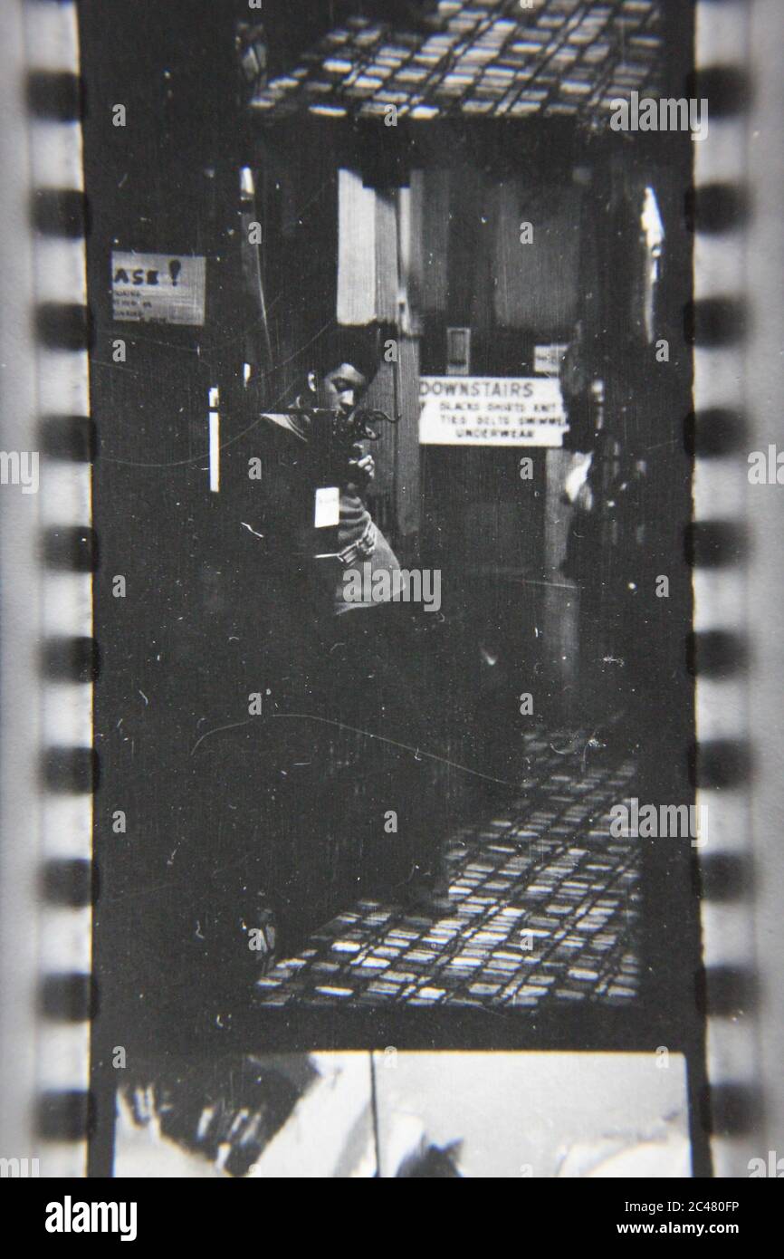 Fine 1970s Vintage Black And White Photography Of A Young Man Smoking A Cigarette And Having A Friendly Conversation Image383980878